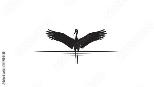 Elegant silhouette of a crane with spread wings standing on water surface in minimalistic