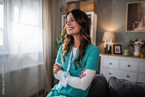 Принти на полотні Smiling female nurse wearing scrubs with confident pose