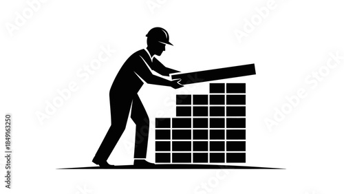 Silhouette of a construction worker with safety helmet lifting a plank over stacked bricks
