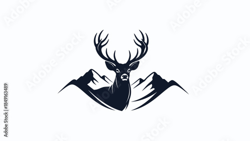Majestic stag with expansive antlers standing among mountain peaks in minimalist silhouette