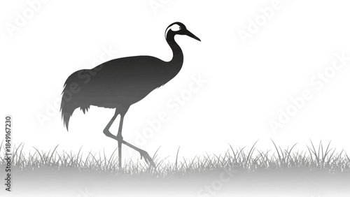 Serene black and white silhouette of a crane standing in lush grass across open landscape