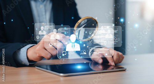 Corporate talent selection concept with digital profiles and magnifying glass on tablet representing strategic recruitment and evaluation workflow