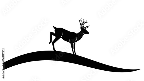 Silhouette of a majestic stag standing on a curved landscape under a clear sky for nature and