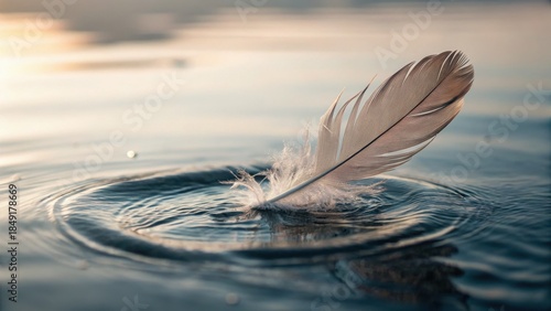 Mental health awareness concept. Delicate feather floating on water surface with gentle ripples.