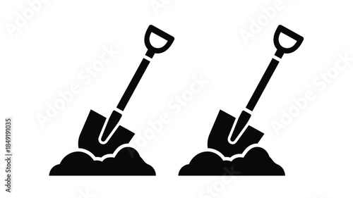 Two black silhouettes of shovels digging into piles of earth silhouette