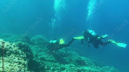 Wallpaper Mural Scuba Divers Exploring Deep Underwater World in 4K Torontodigital.ca