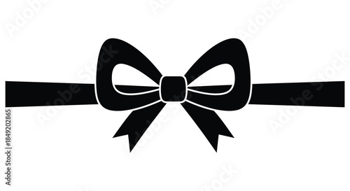 A simple black ribbon formed into a decorative bow shape a striking silhouette