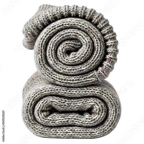 Rolled up grey towels on black background