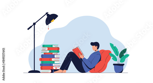 Young man enjoying a peaceful evening reading his favorite book while sitting on a comfortable beanbag under a bright floor lamp.
