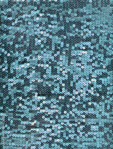 Teal blue sequin fabric texture with reflective shimmering discs, glittery glam background perfect for party decor, fashion design, luxury branding.