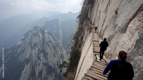 Ultra HD Hiker on plank walk on cliff face of mount hua huashan, shaanxi province, china video
