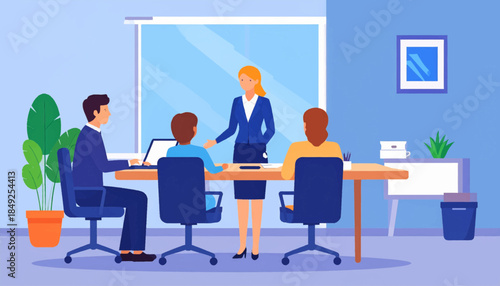 Business meeting in a room with coworkers, laptop, and plant, inside a modern space