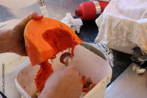 Male Hands Preparing Pumpkin for Soup at a Winter Market Stall