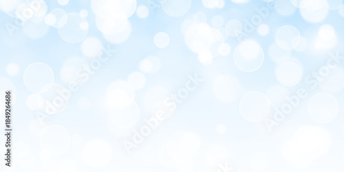 Fantasy shimmer bright star light with glistering stardust and confetti overlay. Abstract sparkle bokeh festive background with glowing dust particles in blue tones.