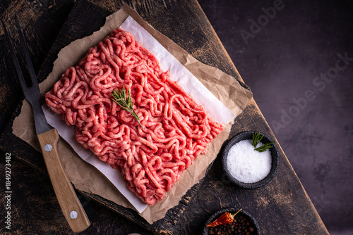 Quadro em tela Raw minced meat on dark background