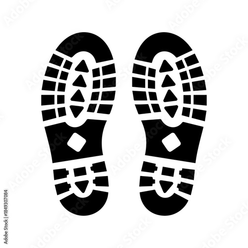 Footstep Tracks: Two black imprints, footprints of a shoe sole, are displayed on a light surface. They provide a clear visual of a tread, useful for illustrating steps or a journey.