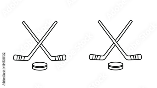 Two crossed hockey sticks and a puck a stark visual silhouette