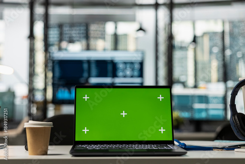 Εκτύπωση καμβά Laptop showing green screen sits on table in modern, empty office, ready for company employees