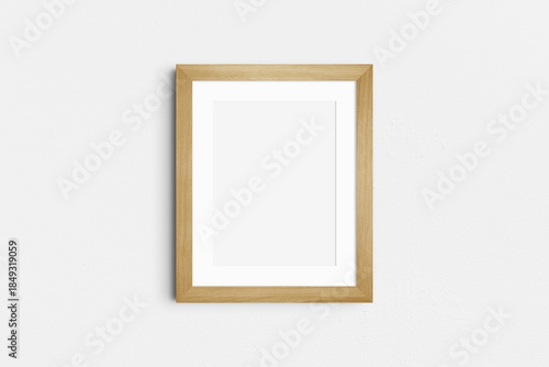 Frame mockup 4:5. Single oak wood frame mockup. Clean, modern, minimalist, bright. Portrait. Vertical. Passepartout/mat opening in 3:4 aspect ratio.