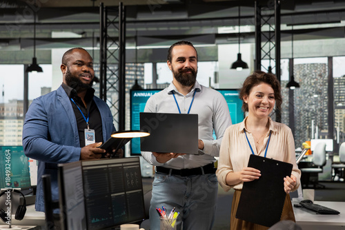 Photos Multiethnic employees work with technology and performance metrics, aligning business strategy and project objectives to drive results and success within a multinational company environment