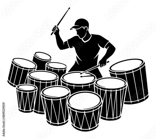 Silhouette of a male percussionist playing multiple drums with sticks