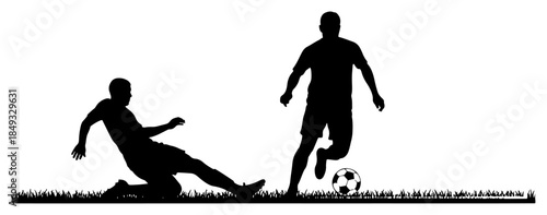 Soccer player sliding to tackle opponent with ball on grass field