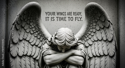 Stone angel statue with wings folded, head bowed in grief, conveying a sense of loss and reflection in a solemn, monochromatic setting.