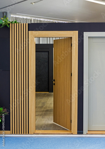 Open wooden door entrance inside corridor interior