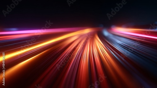 Dynamic light trails of colorful streaks in a dark background, representing speed and motion