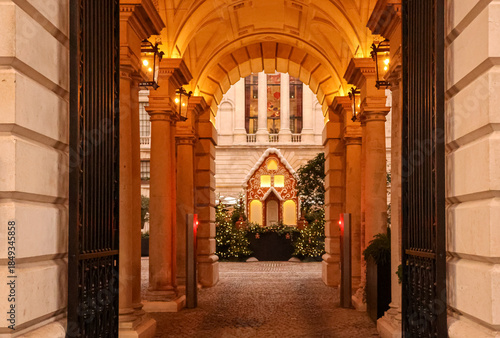 Fotografie London Christmas courtyard with festive gingerbread house and illuminated season