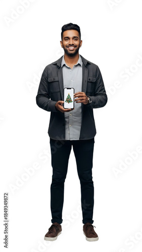 Smiling 27-31-year-old South Asian man, a holiday-themed social media manager, holding a smartphone with festive graphics. Ideal for seasonal marketing, business promotions, holiday campaigns,