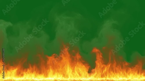 Realistic wall of fire flames burning on green screen background with rising smoke