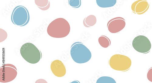 Pastel Easter eggs scattered on a white background for spring decoration