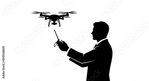 A man in a suit operates a drone with a remote controller outdoors.