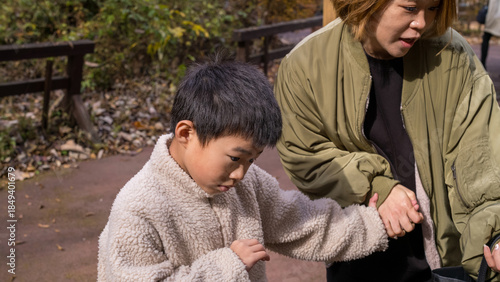Bilde på lerret Parent providing gentle support and guidance to a child with severe developmenta