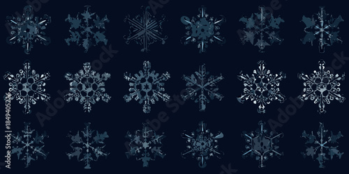 An array of uniquely shaped dark blue snowflakes against a deep background