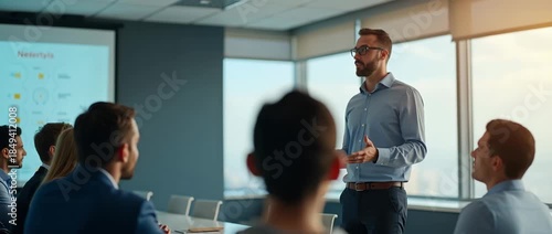 Confident business professional presents in modern conference room, animated gestures enhance engagement, while camera smoothly pans across attentive audience, capturing cinematic corporate dynamics.