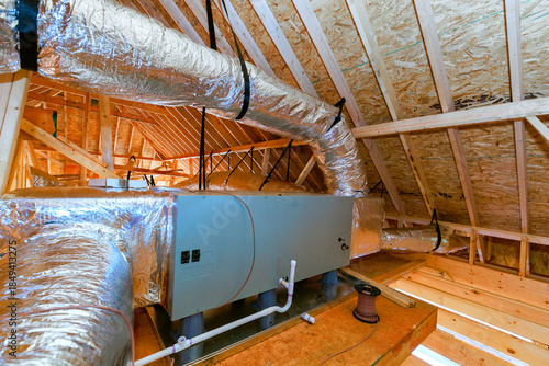 Принти на полотні Installation of HVAC system in attic space during home construction process at r