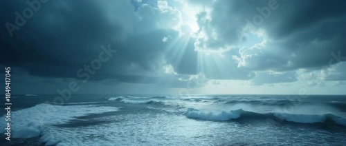 Dramatic ocean waves crash under stormy skies as sunlight pierces through clouds, with a slow cinematic pan capturing the serene yet powerful seascape, perfect for nature documentary footage.