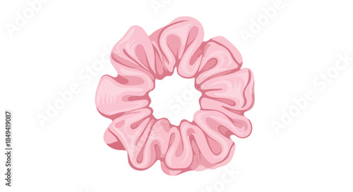 A delightful soft pink fabric scrunchie, an essential hair accessory featuring elegant flowing ripples and a plush, ruffled texture, ideal for