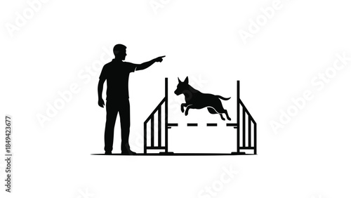 Man training dog to jump over hurdle