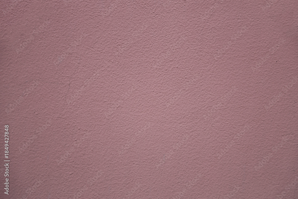 Fototapeta premium Close-up of a purple violet painted wall with texture rough surface Beautiful purple painted modern wall texture, different purple tones, purple background