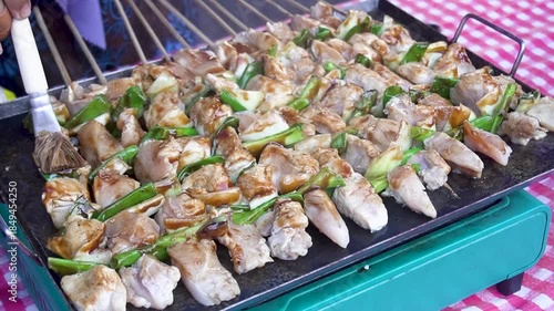 Grilling big yakitori (Japanese style skewered chicken)