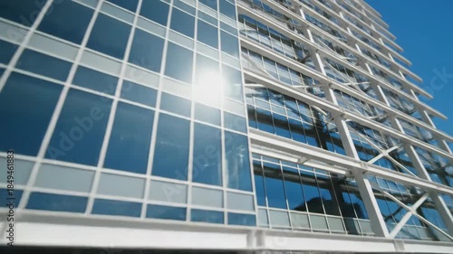 Dynamic View of a Modern Office Building's Reflective Glass and Steel Architecture