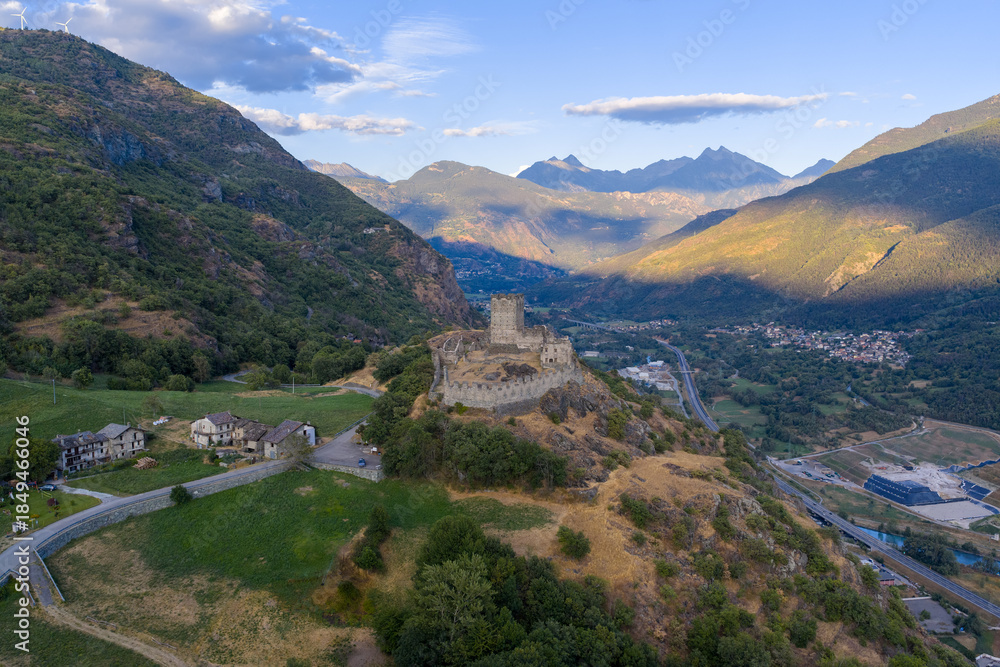 Fototapeta premium Castello di Cly on hillside above valley - Saint-Denis, Italy
