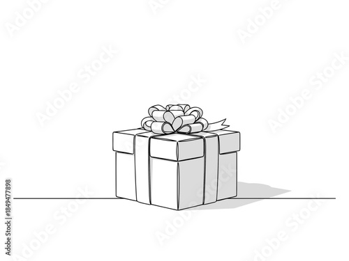 A beautifully wrapped gift box with a white ribbon on top