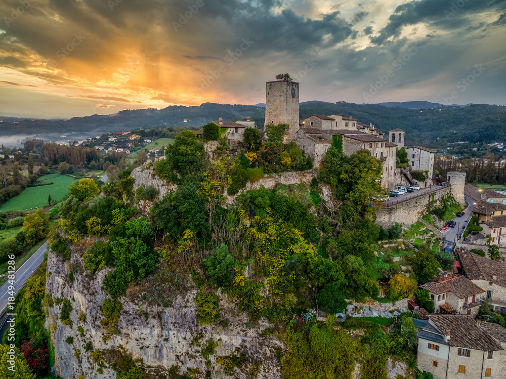 Naklejka premium Aerial view of Arrone medieval hilltop village with castle in Valnerina valley Umbria Italy Dramatic sunset sky
