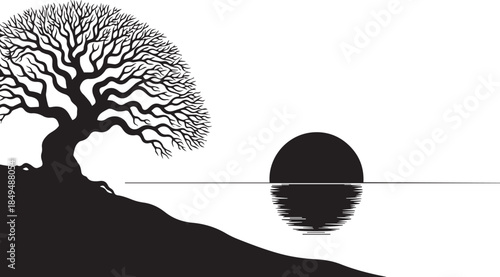 Silhouette of a majestic tree overlooking a serene sunset or sunrise reflected on calm water