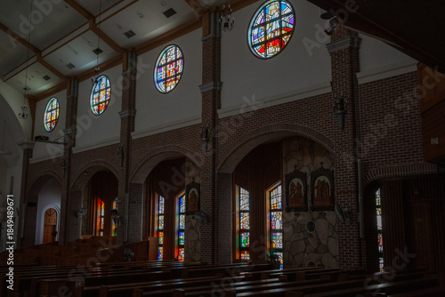 colorful stained glass inside catholic church in jeju island