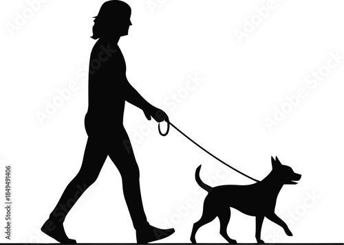 Silhouette of a person walking a small dog on a leash